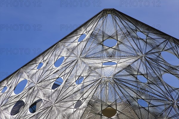 Reutlingen University, Reutlingen University, Texoversum, German University Building Award 2024 for TEXOVERSUM, modern architecture, facade made of carbon and glass fibres, mesh, innovative, identity-creating, unique facade, campus, place of learning, special, extraordinary new building for textile courses, light, airy, airy, holes, detail, architectural eye-catcher, Reutlingen, Baden-Wuerttemberg, Germany, Europe