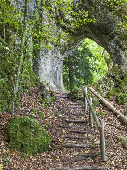Hiking trail leads through a rock gate, Goessweinstein, Franconian Switzerland, Upper Franconia, Franconia, Bavaria, Germany, Europe