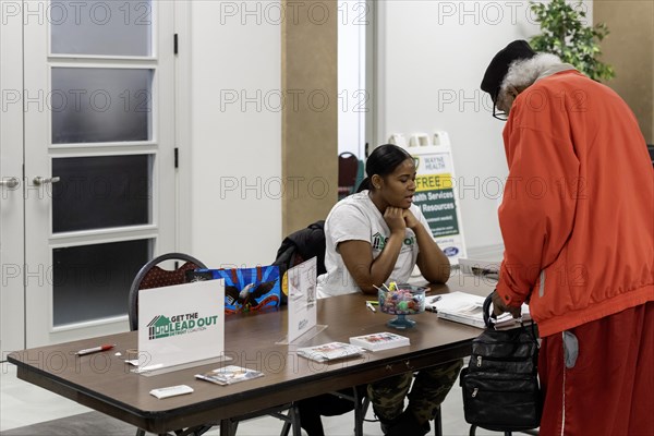 Detroit, Michigan, A woman explains the city's plan to replace all lead water service lines at a community health fair