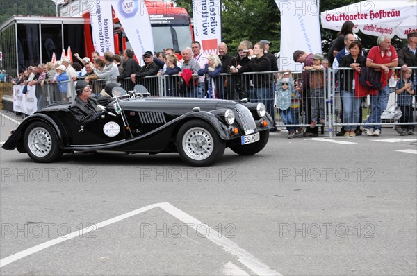 A black convertible classic car at a racing event with spectators in the background, SOLITUDE REVIVAL 2011, Stuttgart, Baden-Wuerttemberg, Germany, Europe