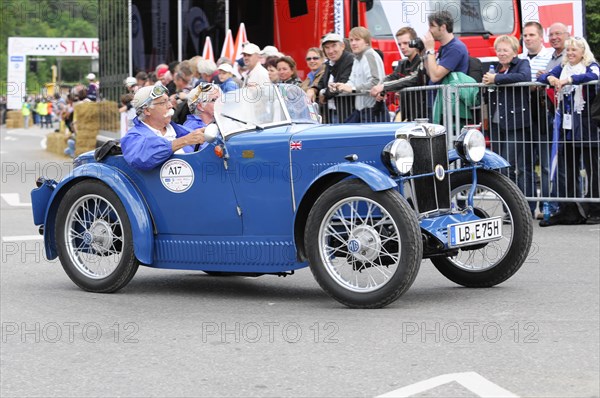 A blue vintage sports car drives past a fence, driver and passenger in the cockpit, SOLITUDE REVIVAL 2011, Stuttgart, Baden-Wuerttemberg, Germany, Europe