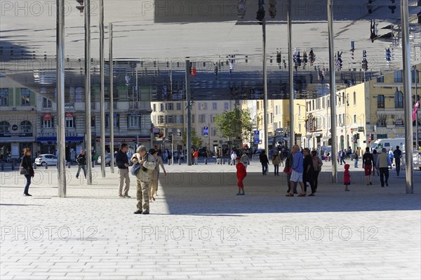 Shade structures made of 1000 square metres of polished stainless steel, architect Norman Foster, built in 2013 at the old harbour, Marseille, city walk on a square with an interesting reflection of buildings, Marseille, Departement Bouches-du-Rhone, Provence-Alpes-Cote d'Azur region, France, Europe