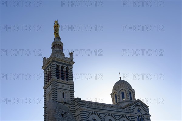 Church of Notre-Dame de la Garde, Marseille, spire of a church with a golden statue against the blue sky, Marseille, Departement Bouches du Rhone, Region Provence Alpes Cote d'Azur, France, Europe