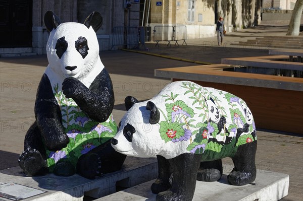 Two panda sculptures on a square, one colourfully painted with floral motifs, Marseille, Departement Bouches-du-Rhone, Provence-Alpes-Cote d'Azur region, France, Europe