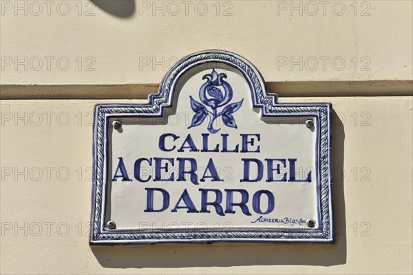 Granada, ceramic tile street sign 'Calle Acera del Darro' on a light-coloured house wall, Granada, Andalusia, Spain, Europe