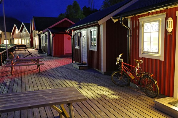 Bicycle standing in front of a cosy wooden hut on a jetty, Rorbuer, holiday, fishing, Halsa, Kystriksveien, FV 17, Norway, Europe