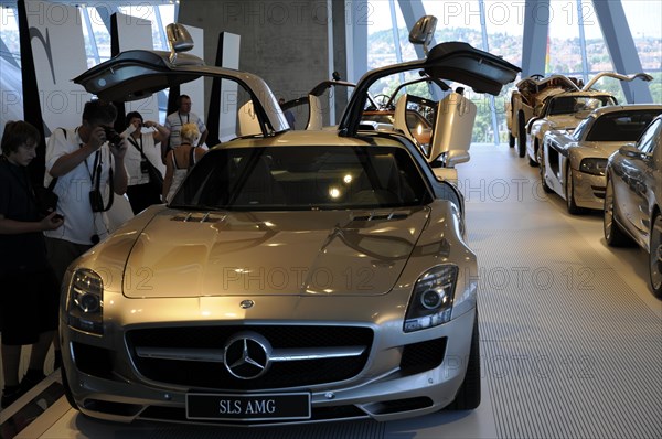 Museum, Mercedes-Benz Museum, Stuttgart, Silver Mercedes SLS AMG sports car with open gullwing doors in a showroom, Mercedes-Benz Museum, Stuttgart, Baden-Wuerttemberg, Germany, Europe