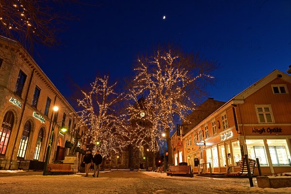 The pedestrian zone in winter is brightly lit in the evening, Trondheim, Norway, Europe