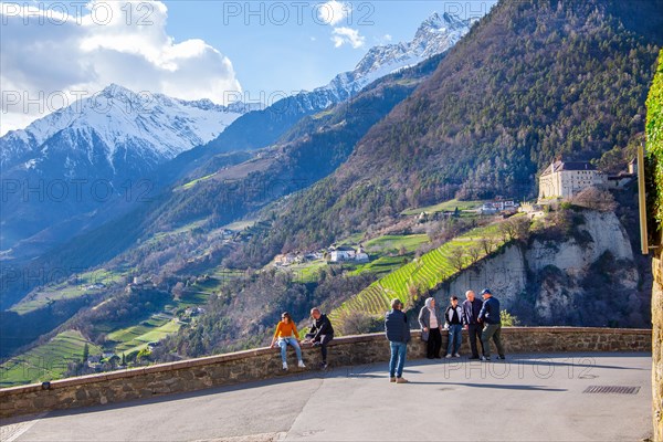 Panoramic terrace with castle view in front of the Texel Group with the peak 3006m in spring, Dorf Tyrol near Meran, Etschtal, Burggrafenamt, Alps, South Tyrol, Trentino-South Tyrol, Italy, Europe