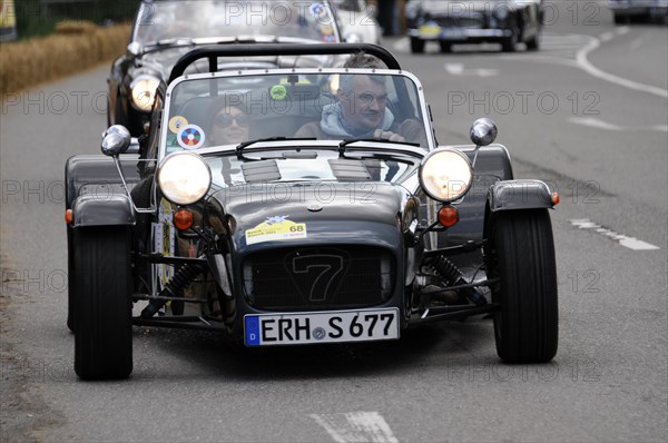 A black Caterham 7 sports car takes part in a racing event on a road, SOLITUDE REVIVAL 2011, Stuttgart, Baden-Wuerttemberg, Germany, Europe
