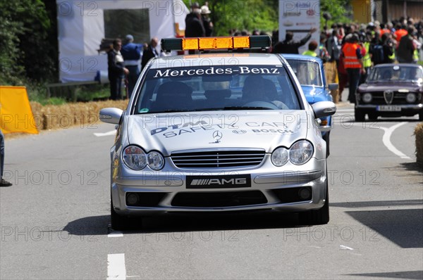 The white Mercedes-AMG safety vehicle on a race track surrounded by spectators, SOLITUDE REVIVAL 2011, Stuttgart, Baden-Wuerttemberg, Germany, Europe