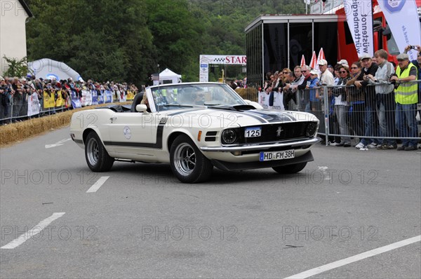 White Ford Mustang convertible at a classic car rally with spectators in the background, SOLITUDE REVIVAL 2011, Stuttgart, Baden-Wuerttemberg, Germany, Europe