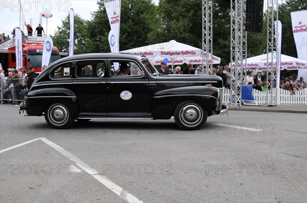 A black vintage car drives past a crowd at an event, SOLITUDE REVIVAL 2011, Stuttgart, Baden-Wuerttemberg, Germany, Europe