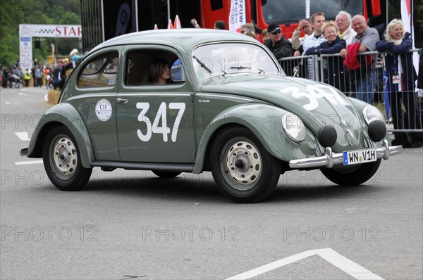 A green Volkswagen Beetle classic car with racing number on the road, SOLITUDE REVIVAL 2011, Stuttgart, Baden-Wuerttemberg, Germany, Europe