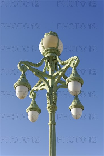 Marseille, Antique green street lamp in front of a clear blue sky, Marseille, Departement Bouches-du-Rhone, Region Provence-Alpes-Cote d'Azur, France, Europe