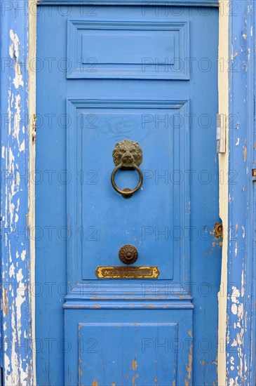 Marseille, Detailed view of an old blue door with door knocker and peeling paint, Marseille, Departement Bouches-du-Rhone, Provence-Alpes-Cote d'Azur region, France, Europe