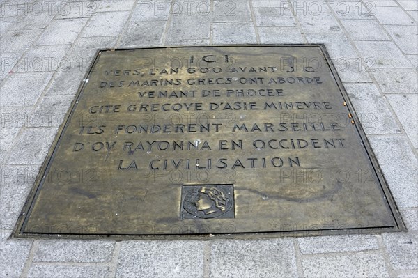 Marseille, plaque embedded in the pavement marking the foundation of Marseille, Marseille, Departement Bouches-du-Rhone, Provence-Alpes-Cote d'Azur region, France, Europe
