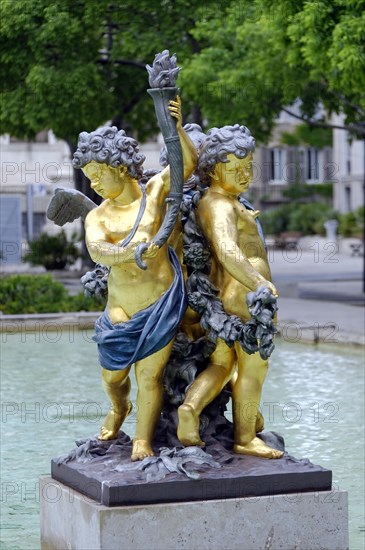 Marseille, Golden sculpture of two figures at a fountain, Marseille, Departement Bouches-du-Rhone, Provence-Alpes-Cote d'Azur region, France, Europe