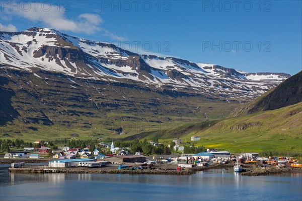 View over harbour and town Seyoisfjoerour along the fjord Seydisfjoerdur in summer, Eastern Region, Austurland, Iceland, Europe