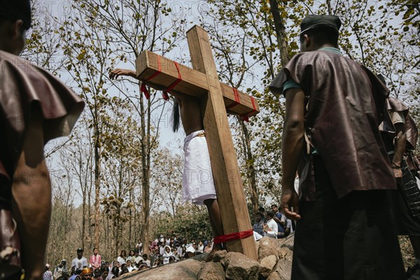 Christian devotees takes part in a perform to re-enactment of the crucifixion of Jesus Christ during a procession on Good Friday, on March 29, 2024 in Guwahati, Assam, India. Good Friday is a Christian holiday commemorating the crucifixion of Jesus Christ and his death at Calvary