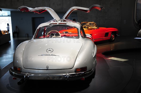 Museum, Mercedes-Benz Museum, Stuttgart, Rear view of a white Mercedes sports car with open gullwing doors, Mercedes-Benz Museum, Stuttgart, Baden-Wuerttemberg, Germany, Europe
