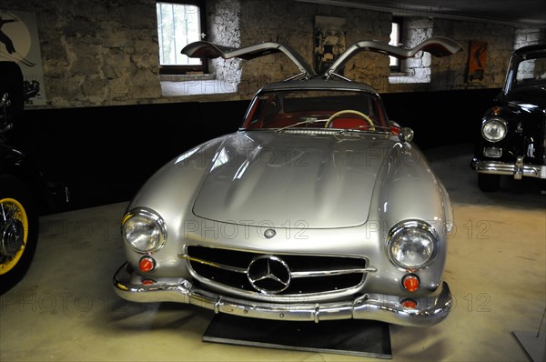 Deutsches Automuseum Langenburg, Front view of a silver Mercedes-Benz classic car with open gullwing doors and chrome details, Deutsches Automuseum Langenburg, Langenburg, Baden-Wuerttemberg, Germany, Europe