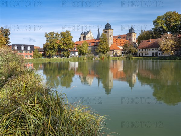 Thurnau Castle reflected in the castle pond, Thurnau, Upper Franconia, Bavaria, Germany, Europe