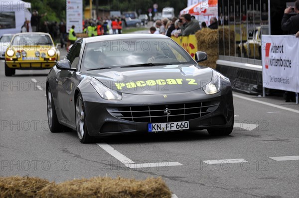 A Ferrari as a pace car on a secured race track surrounded by spectators, SOLITUDE REVIVAL 2011, Stuttgart, Baden-Wuerttemberg, Germany, Europe