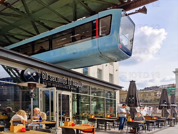 Suspension railway above the outdoor restaurant at the main railway station, Wuppertal, Bergisches Land, North Rhine-Westphalia, Germany, Europe