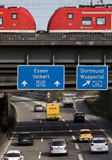 Regional train crosses the A535 motorway at Sonnborner Kreuz, motorway junction, Wuppertal, North Rhine-Westphalia, Germany, Europe