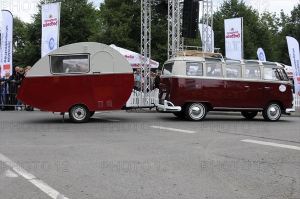 Side view of a VW bus with caravan in front of a crowd of spectators, SOLITUDE REVIVAL 2011, Stuttgart, Baden-Wuerttemberg, Germany, Europe