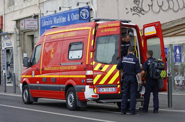 Marseille, rescue workers standing next to a fire engine in action, Marseille, Departement Bouches du Rhone, Region Provence Alpes Cote d'Azur, France, Europe