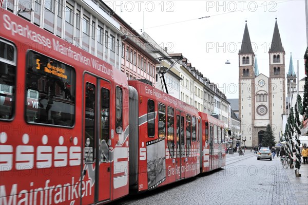 Wuerzburg, tram runs through Wuerzburg's city centre against a historic backdrop of church towers, Wuerzburg, Lower Franconia, Bavaria, Germany, Europe