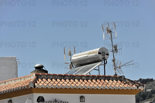 Solabrena, rooftop with antennas and a solar water heater against a clear sky, Costa del Sol, Andalusia, Spain, Europe