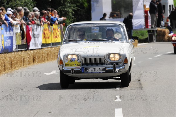 A white BMW classic car drives in front of a crowd during a street race, SOLITUDE REVIVAL 2011, Stuttgart, Baden-Wuerttemberg, Germany, Europe