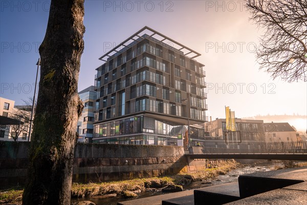 Ibis Styles Hotel, Modern architecture with reflection in a puddle, captured in daylight, sunrise, Nagold, Black Forest, Germany, Europe