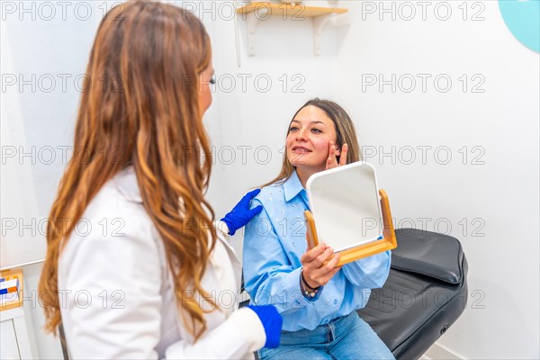 Adult caucasian woman and doctor talking after beauty treatment applying hyaluronic acid injection on lips in a clinic