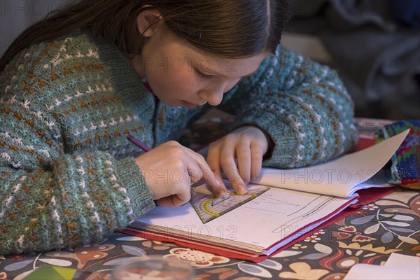 Girl, 10 years old, doing schoolwork, Mecklenburg-Western Pomerania, Germany, Europe