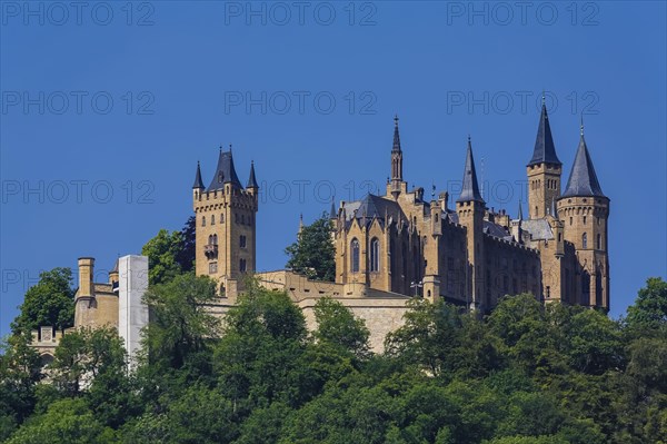 Hohenzollern Castle, ancestral castle of the princely family and former ruling Prussian royal and German imperial house of Hohenzollern, summit castle, historical building by the Berlin architect Friedrich August Stueler, architecture, neo-Gothic, castle building, aristocratic residence, east view, blue sky, Bisingen, Zollernalbkreis, Baden-Wuerttemberg, Germany, Europe
