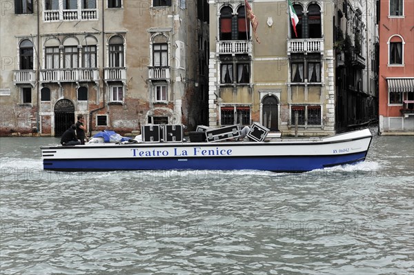 A boat on the water in Venice with the inscription 'Teatro La Fenice', Venice, Veneto, Italy, Europe