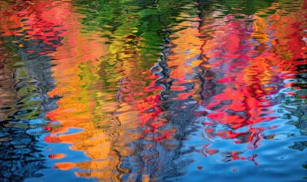 The vibrant colors of autumn reflected in the crystal-clear waters of the lake AI generated