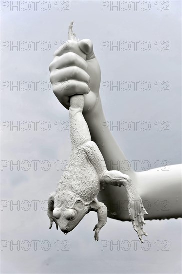 Charles Ray's statue of the boy with a frog on the top of the Zattere, detail of a surrealist sculpture with a white hand holding a frog, Venice, Veneto, Italy, Europe