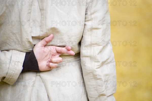 Woman Crossing Fingers Behind Her Back in Switzerland. | MR:yes Maria CH 03-03-2018