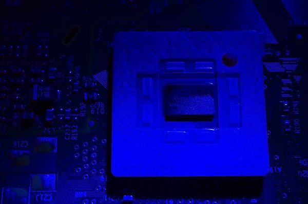 Close-up of blue lighted microchip on electronic computer circuit board, Studio Composition, Quebec, Canada, North America