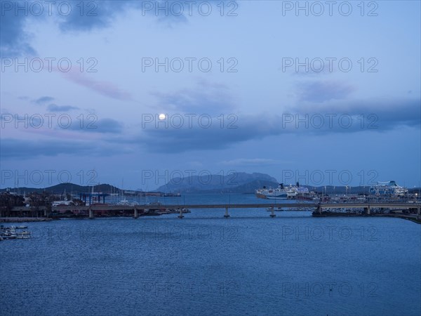 Full moon over the harbour of Olbia, Olbia, Sardinia, Italy, Europe