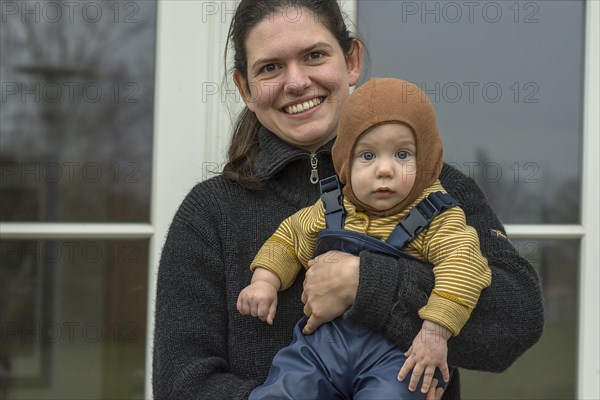 Laughing young mother with her son, 8 months, Mecklenburg-Vorpommern, Germany, Europe