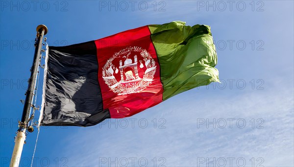 Flag, the national flag of Afghanistan flutters in the wind