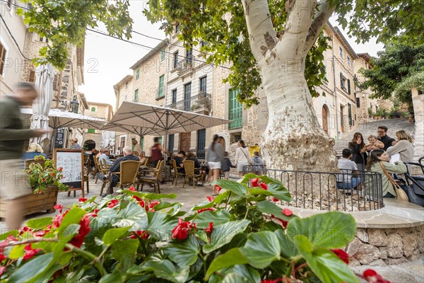 Fornalutx, Spain, November 1 2023: beautiful view with people in the cafe, Europe