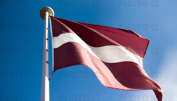 Flags, the national flag of Latvia flutters in the wind