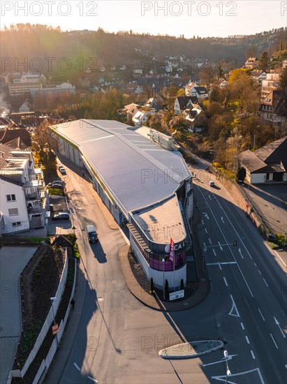 Drone image of a modern building on a street corner in the evening light, Calw, Black Forest, Germany, Europe